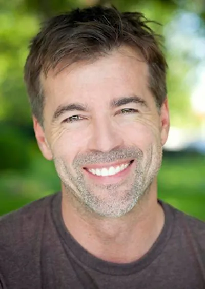 man smiling after getting a dental crown at Moritis & Shin Dentistry in Seattle, WA