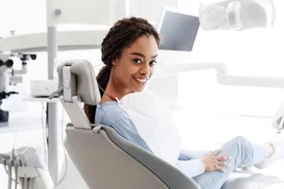 woman smiling in the dental chair at Moritis & Shin Dentistry in Seattle, WA