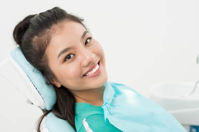 woman receiving dental care at Moritis & Shin Dentistry in Seattle, WA